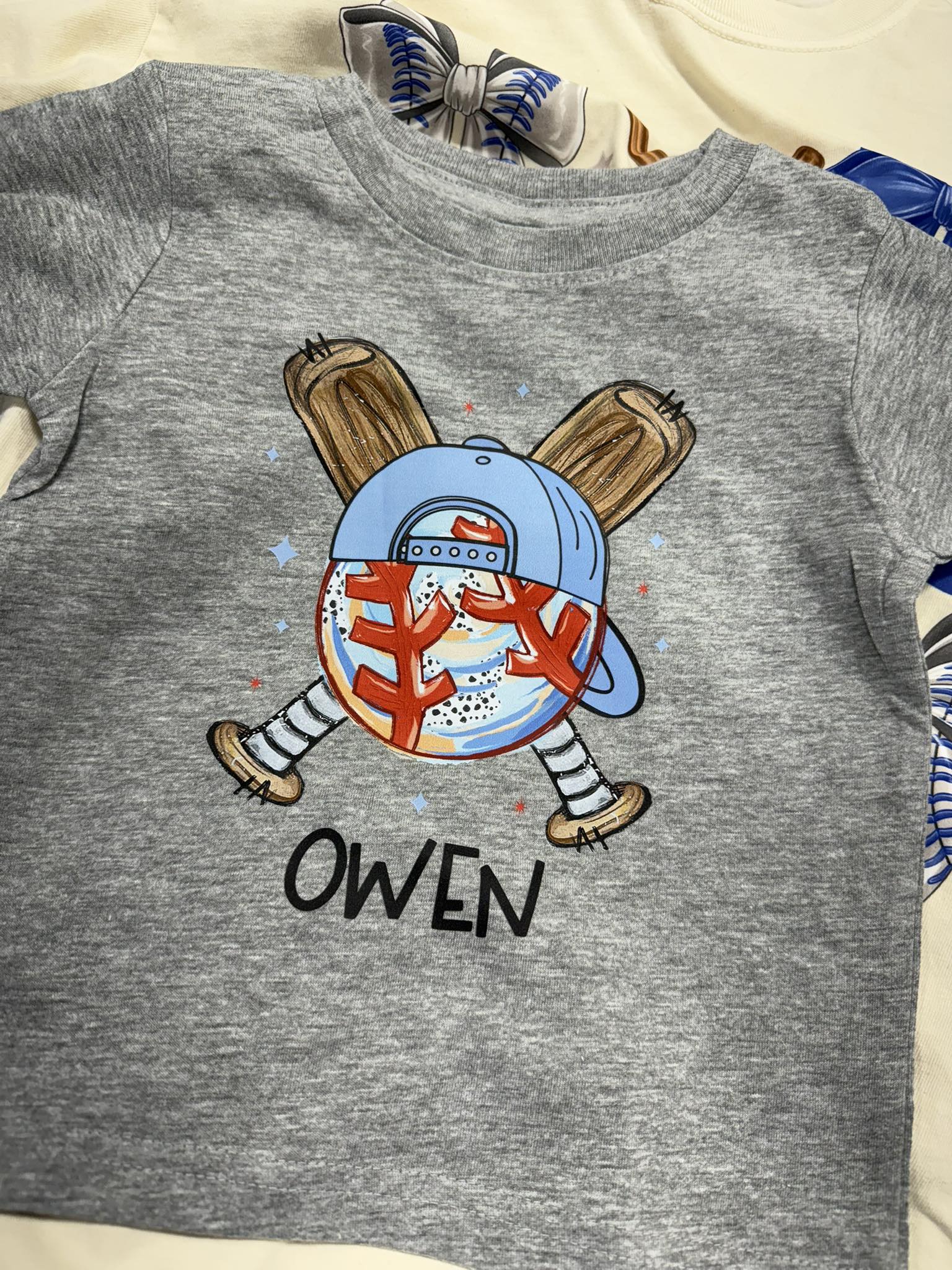 Personalized kids baseball shirt with custom name and baseball character design