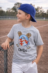 Side profile of child wearing personalized baseball tee at baseball field