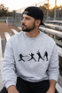 Male model wearing gray baseball crewneck sweatshirt at a baseball field